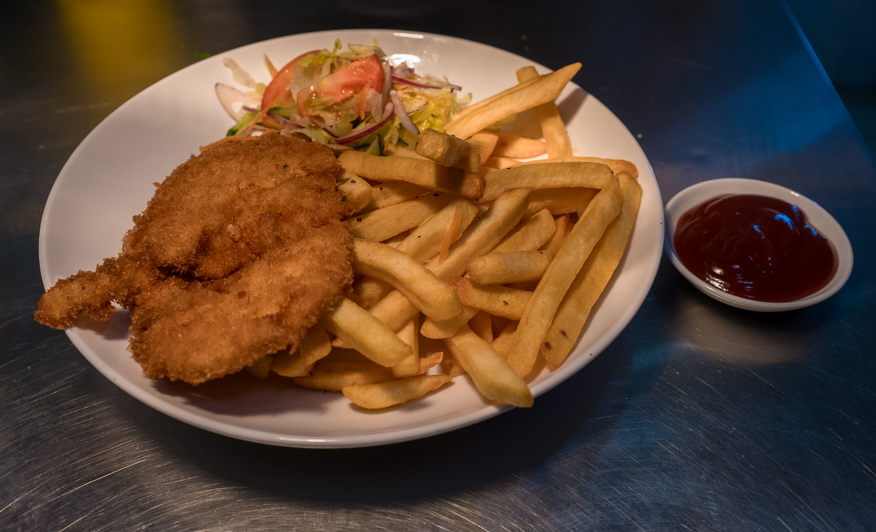 Crumbed chicken with fries at Elements