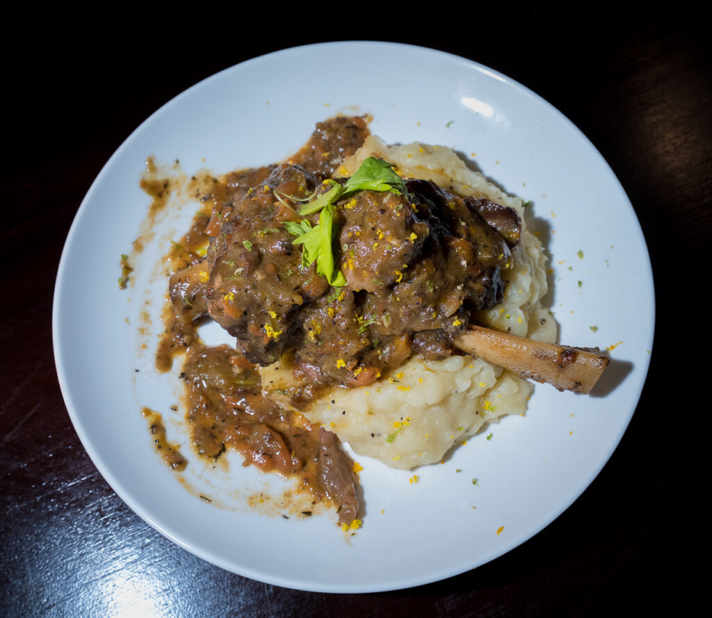 Slow-braised lamb shank on creamy mash