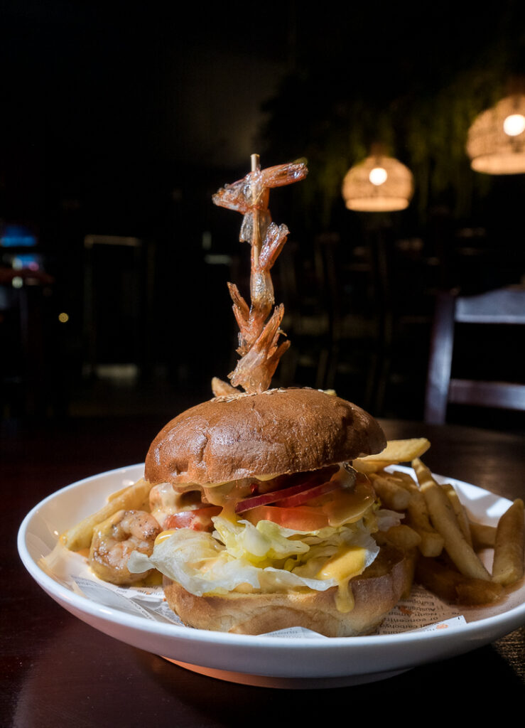 Burger with fries, served with a skewer